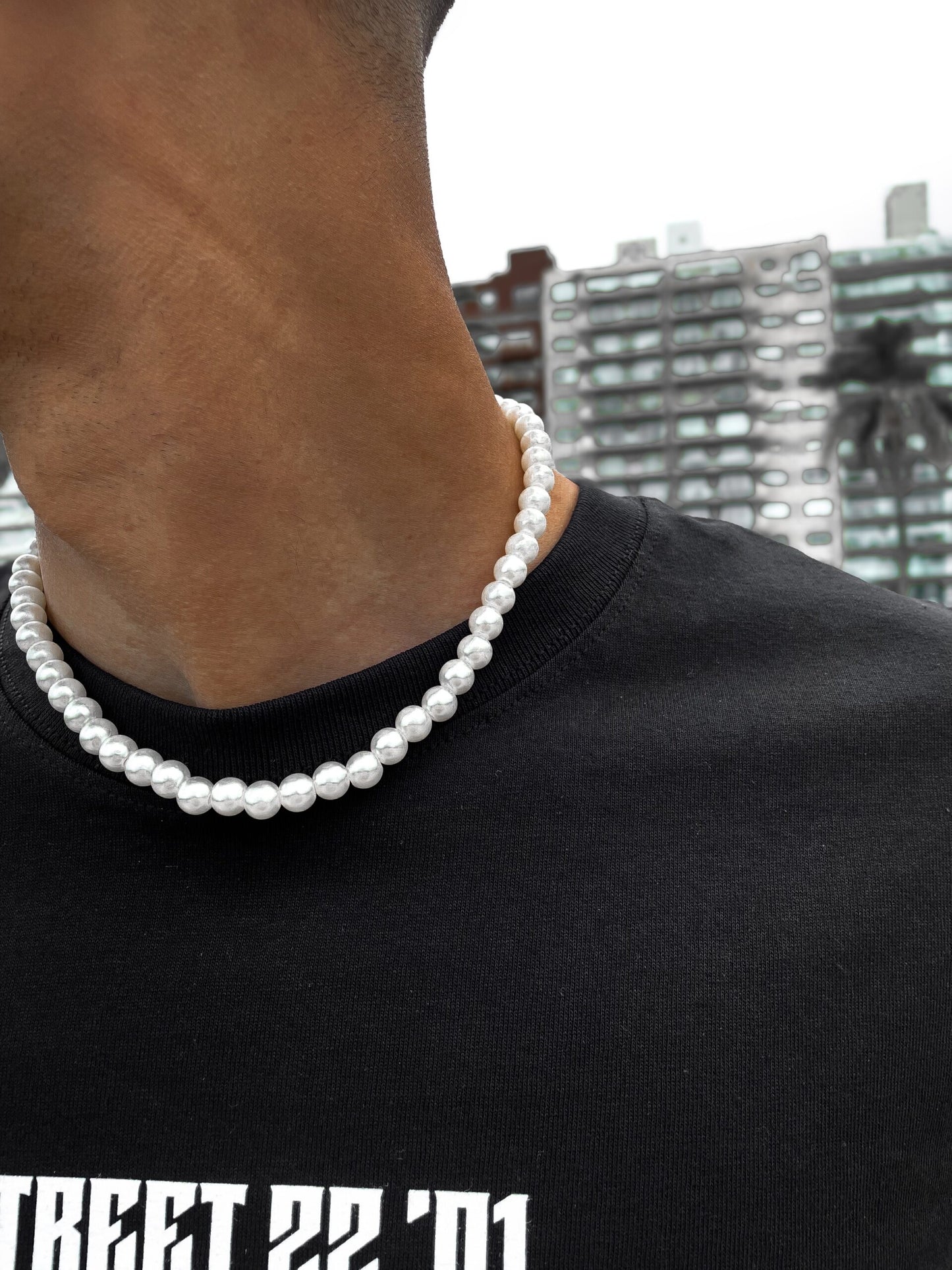 Collar de perlas con dije de cruz